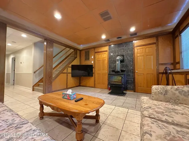 a view of balcony with wooden floor and outdoor seating