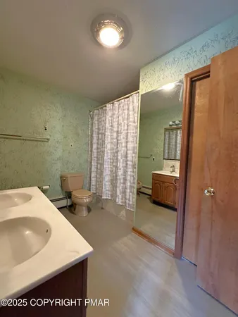 a bedroom with a bed a window and closet