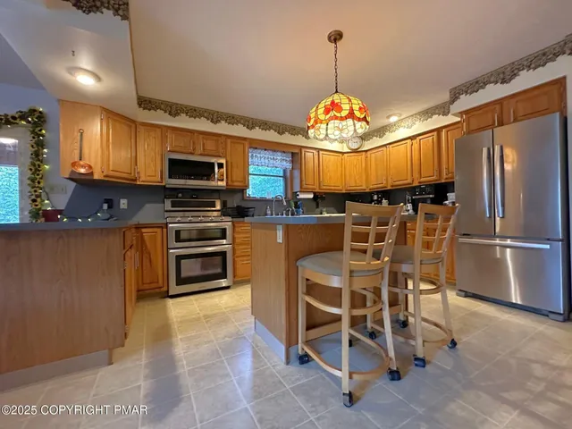 a bedroom with double bed and a chandelier