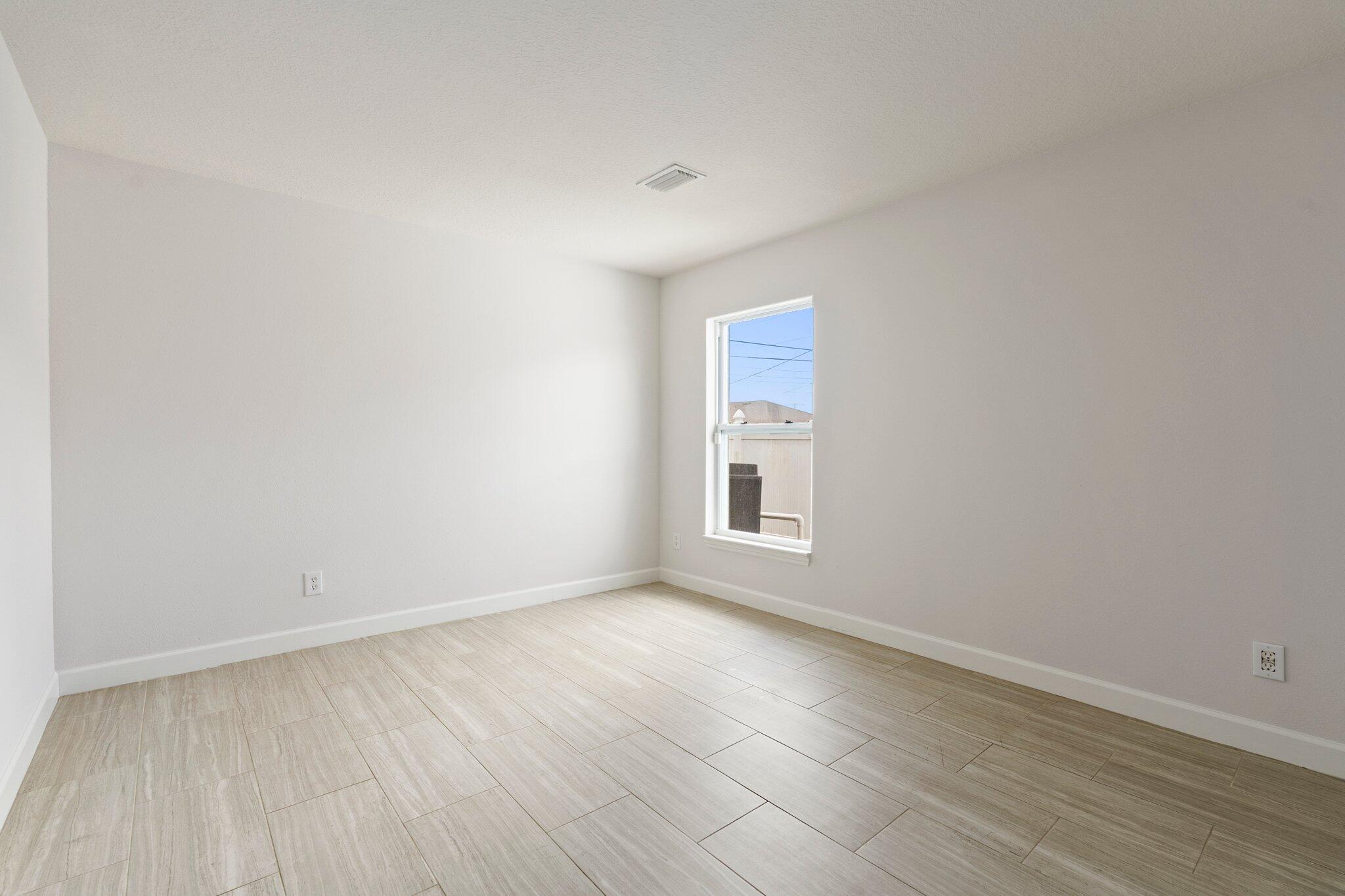 1901 Southwest Diamond Street Port St. Lucie, FL 34953 - Photo 19 of 42 an empty room with a window