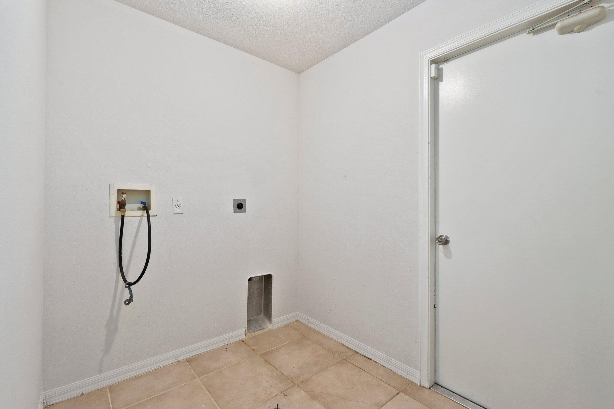 1901 Southwest Diamond Street Port St. Lucie, FL 34953 - Photo 30 of 42 a bathroom with a glass shower door