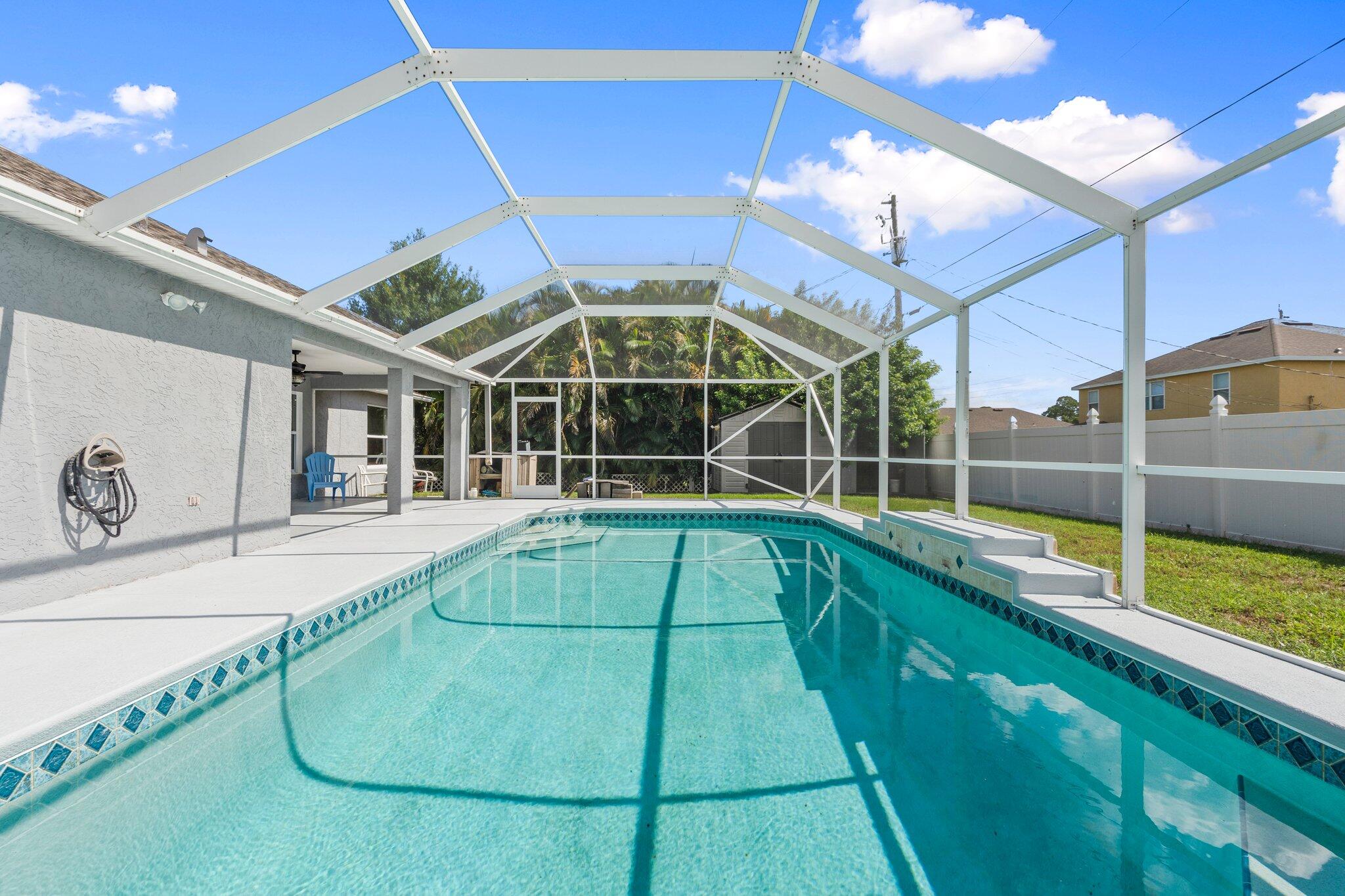 1901 Southwest Diamond Street Port St. Lucie, FL 34953 - Photo 32 of 42 a view of a swimming pool
