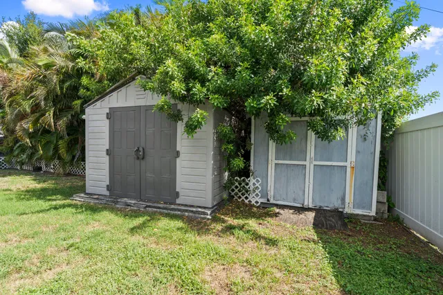 a front view of house with yard and trees