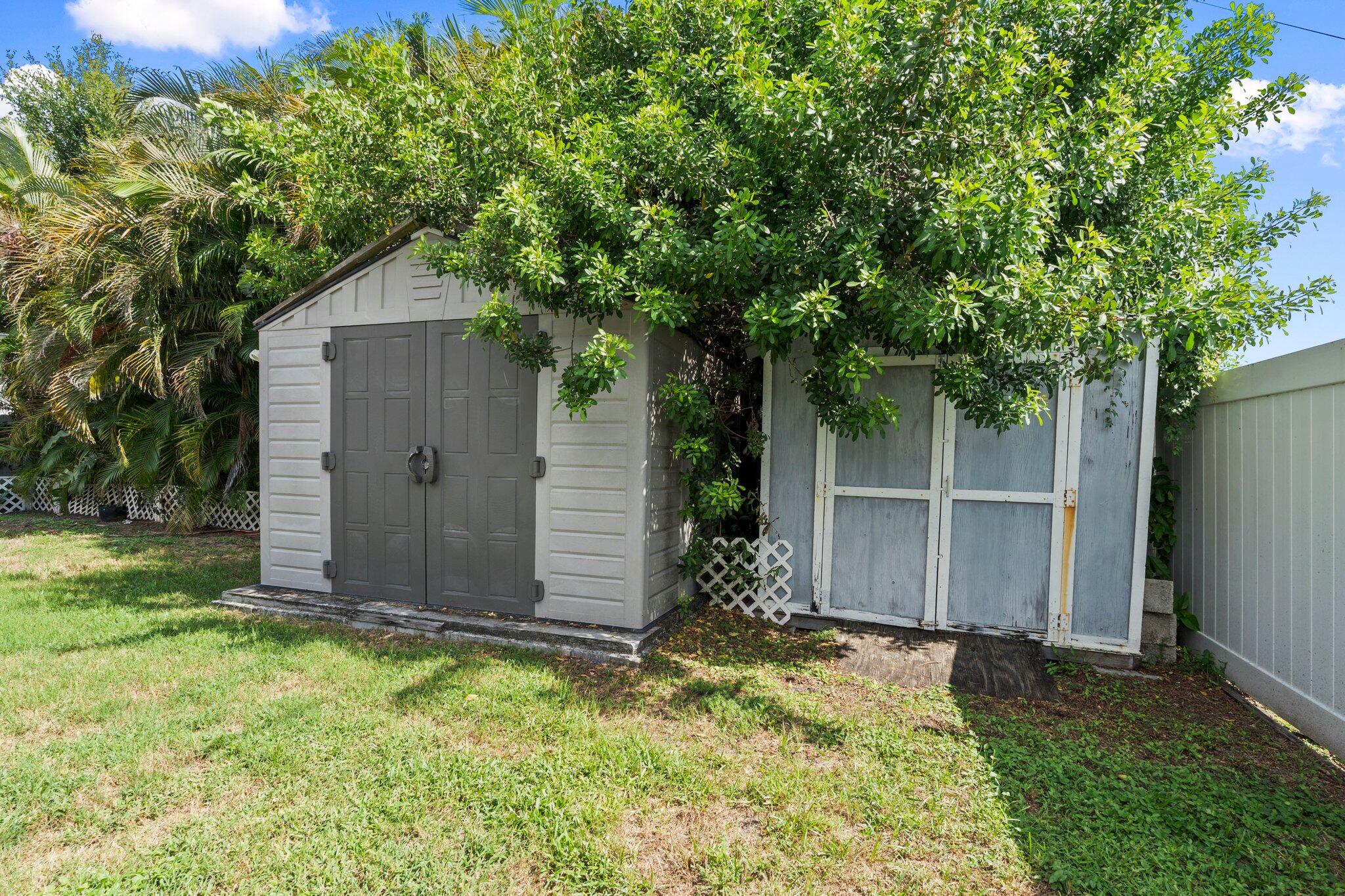 1901 Southwest Diamond Street Port St. Lucie, FL 34953 - Photo 36 of 42 a front view of house with yard and trees