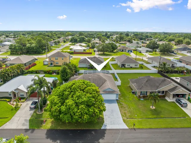 an aerial view of a house with outdoor space pool patio and outdoor seating