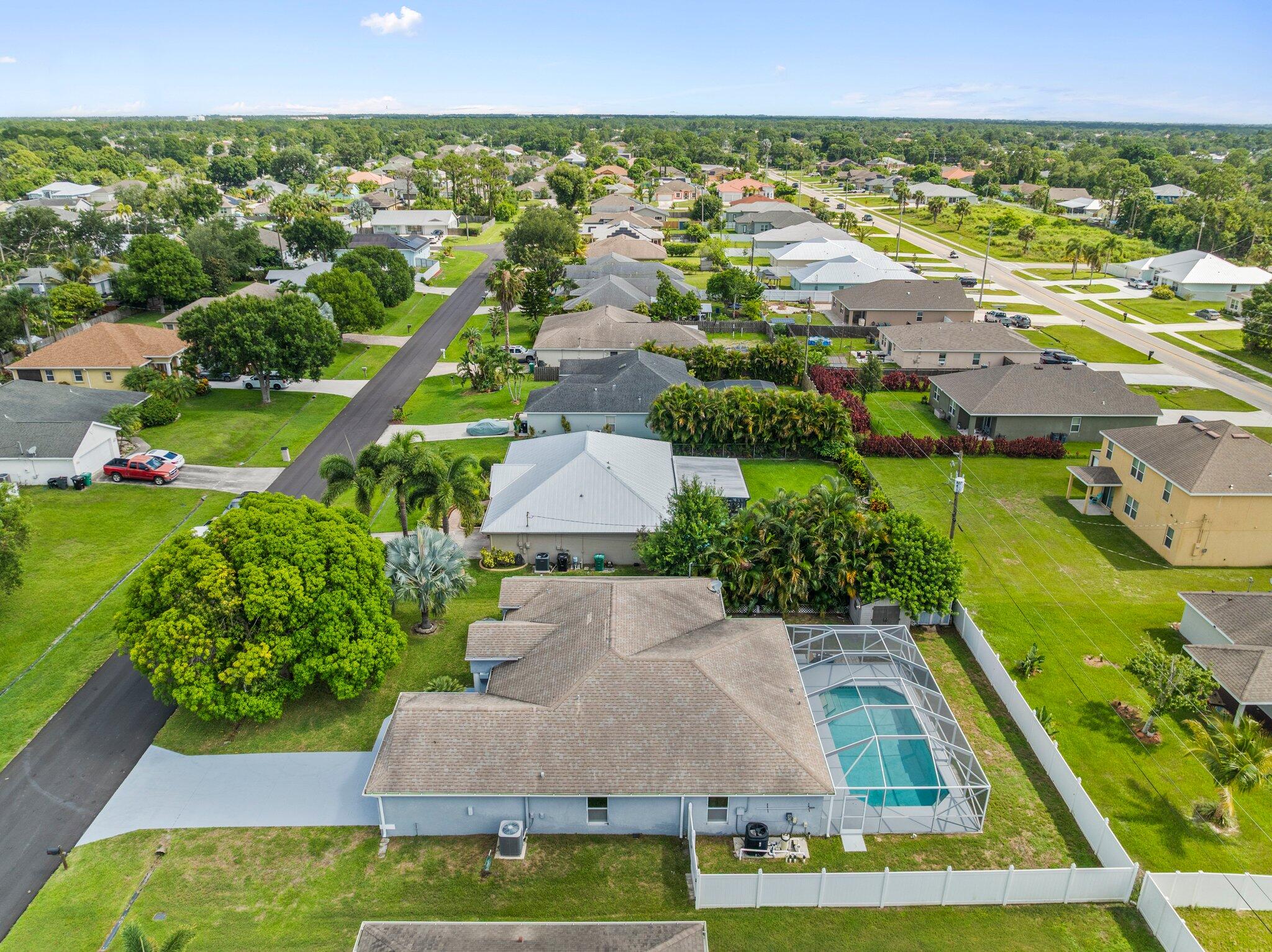 1901 Southwest Diamond Street Port St. Lucie, FL 34953 - Photo 39 of 42 an aerial view of residential houses with outdoor space and swimming pool