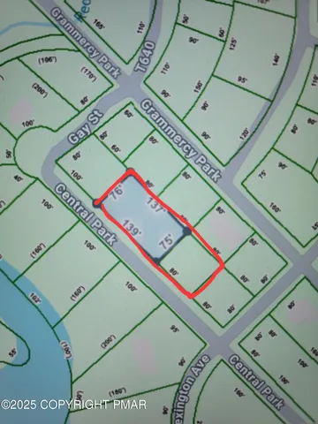 view of a room that has a bed and a small wooden floor