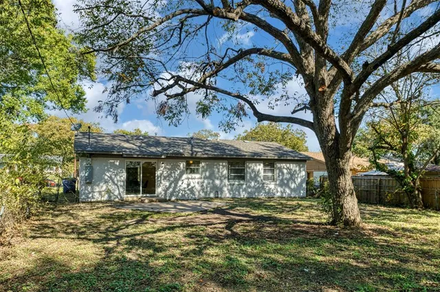 a backyard of a house with lots of green space