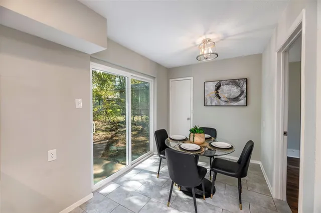 a kitchen with stainless steel appliances a stove and a microwave