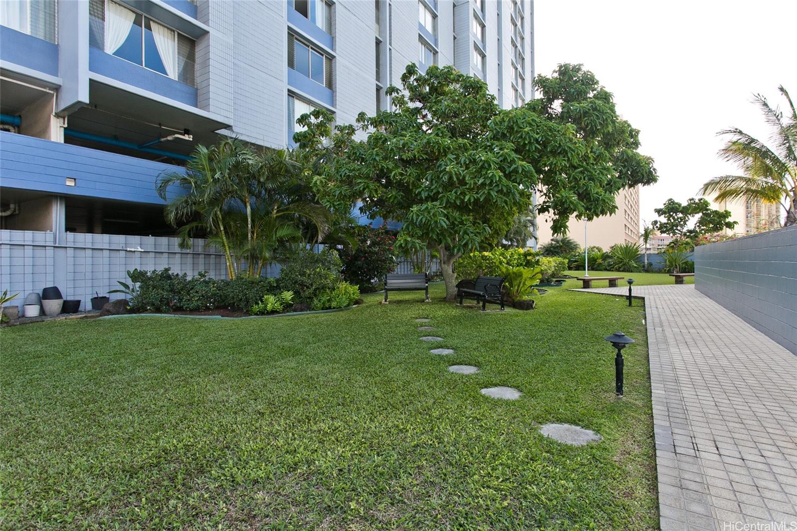 3045 Ala Napuaa Place, Unit 306 Honolulu, HI 96818 - Photo 11 of 15 a view of a yard in front of a building