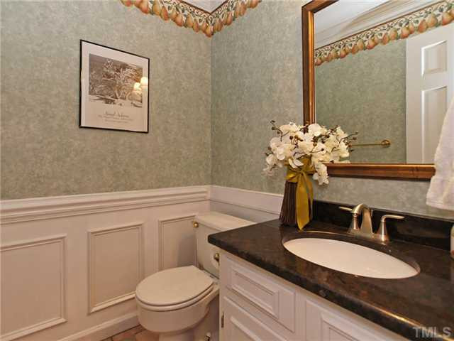 8316 Apple Orchard Way Raleigh, NC 27615 - Photo 11 of 25 Large powder room with new granite, waynes coating, crown! This room located at garage entrance to home. Half Bath