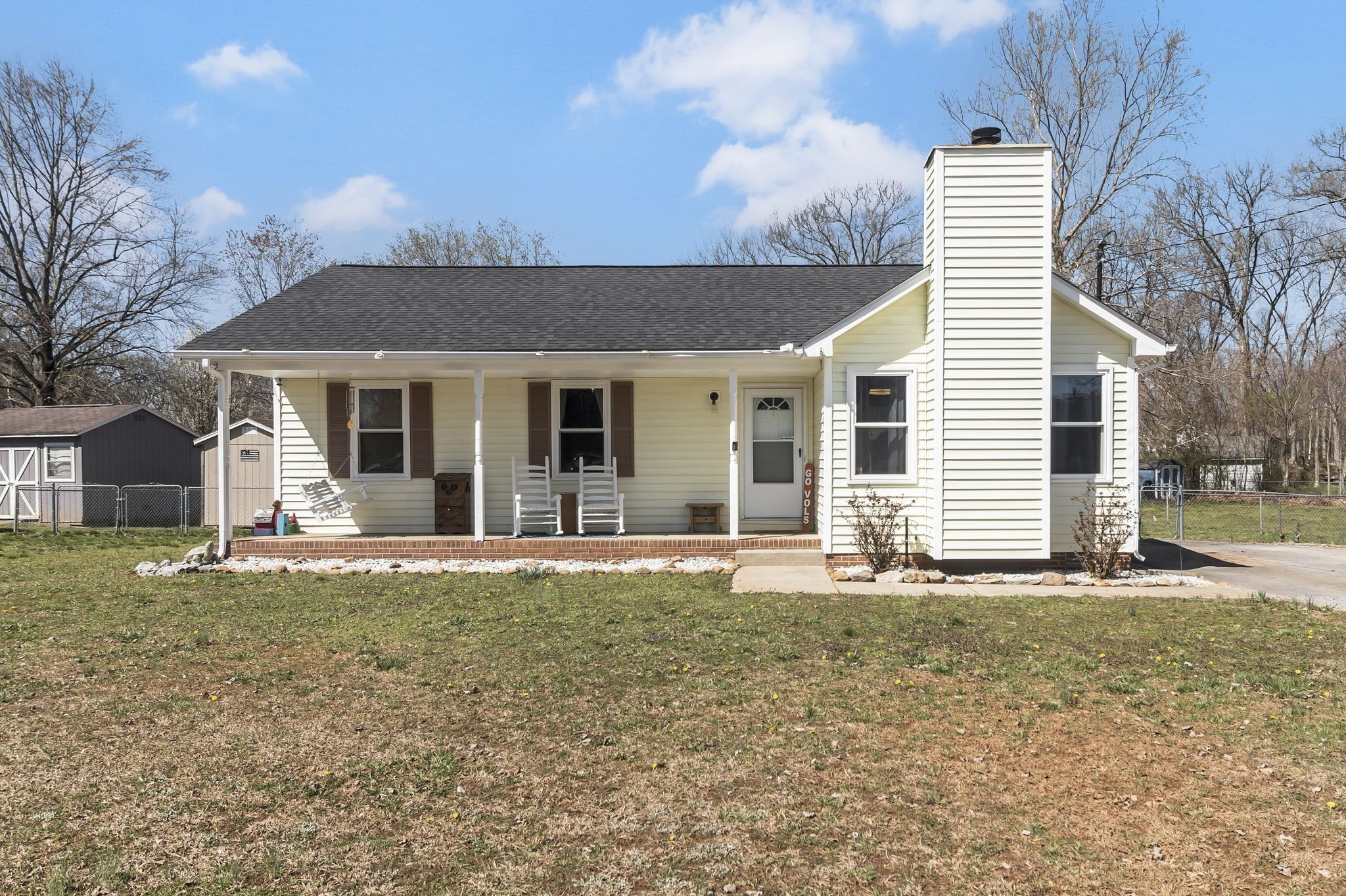 a front view of a house with a yard