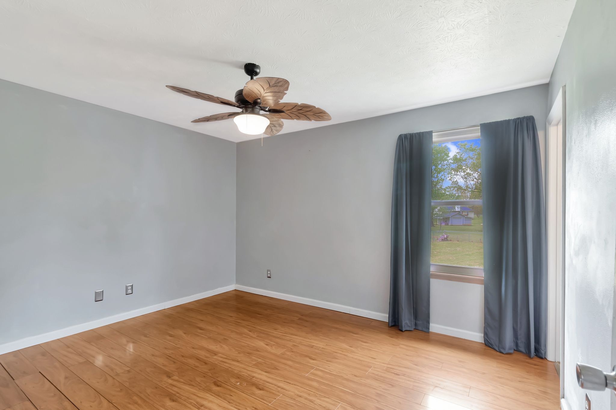 7543 Chadwick Drive Murfreesboro, TN 37129 - Photo 11 of 16 a view of an empty room with wooden floor and a window