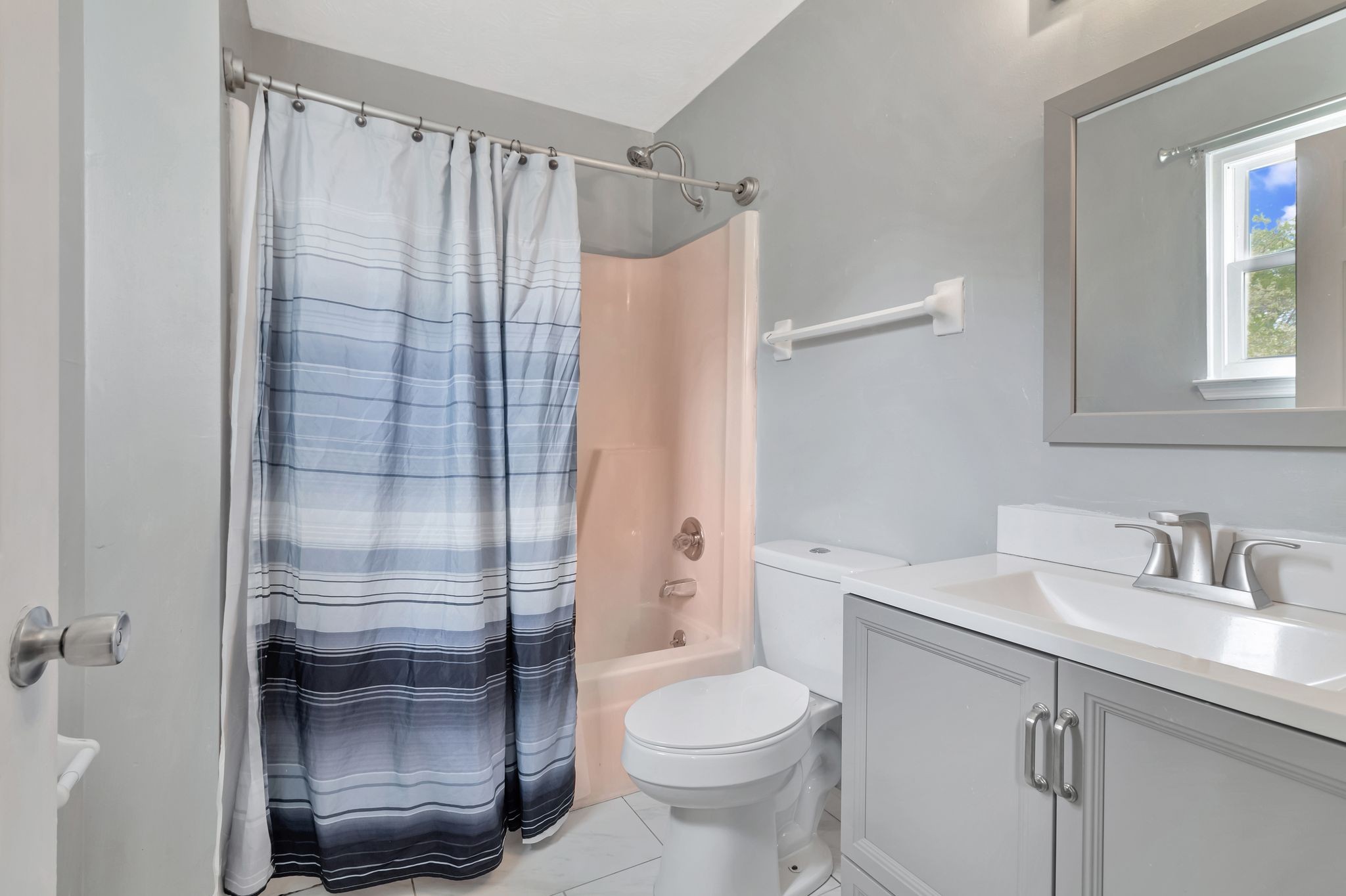 7543 Chadwick Drive Murfreesboro, TN 37129 - Photo 12 of 16 a bathroom with a shower a toilet and sink
