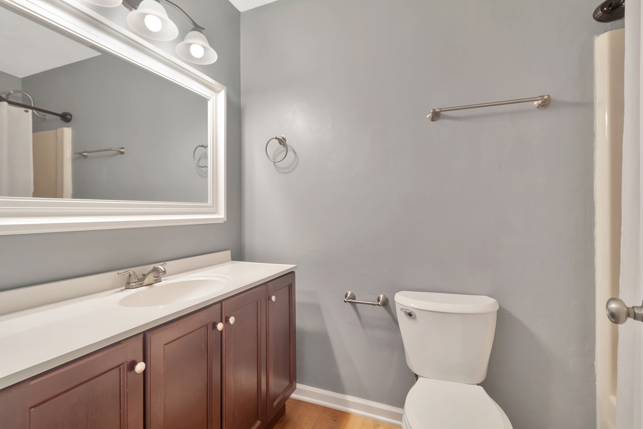 7543 Chadwick Drive Murfreesboro, TN 37129 - Photo 14 of 16 a bathroom with a toilet sink and mirror