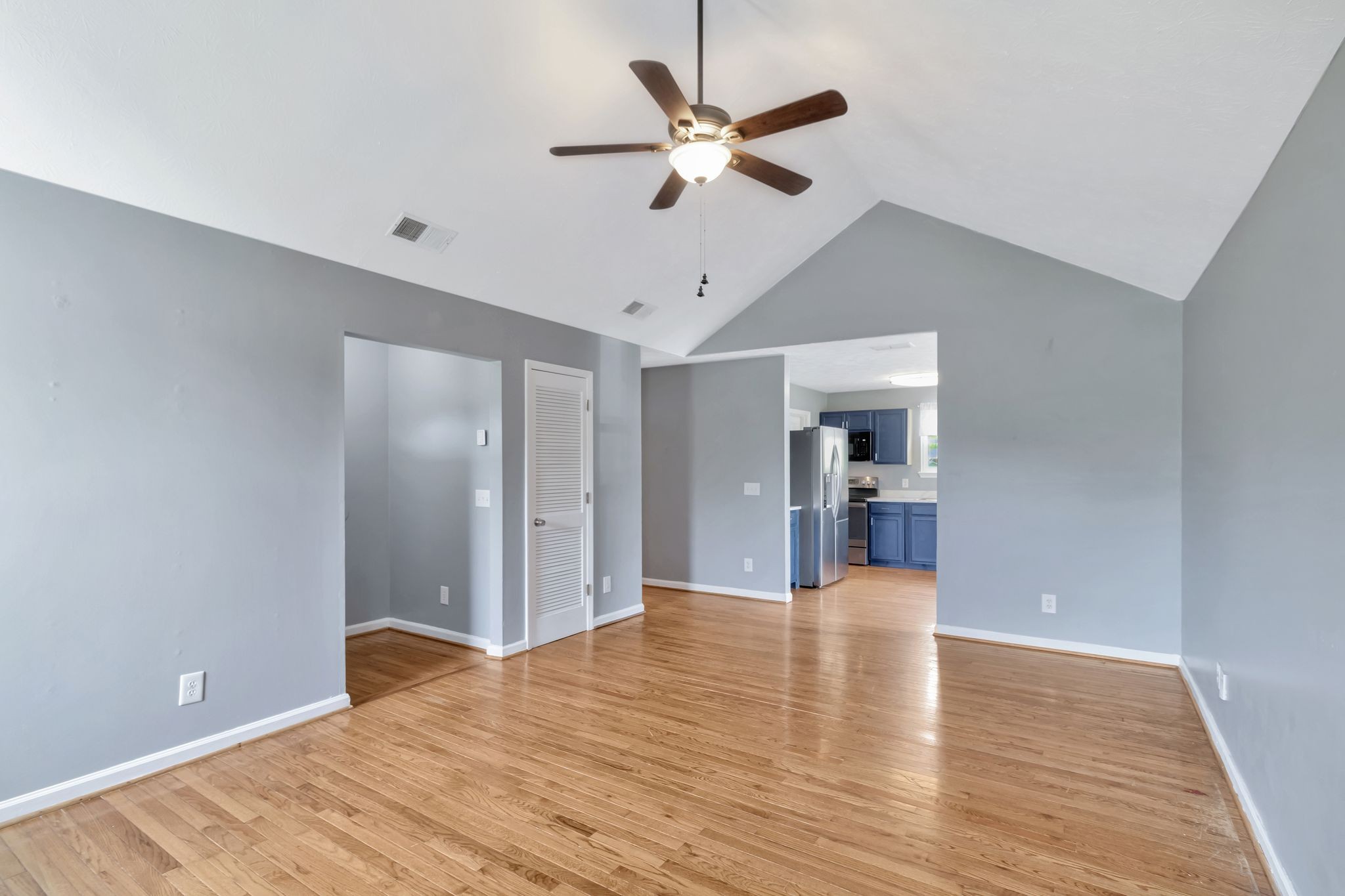 7543 Chadwick Drive Murfreesboro, TN 37129 - Photo 6 of 16 a view of a kitchen with wooden floor and a ceiling fan