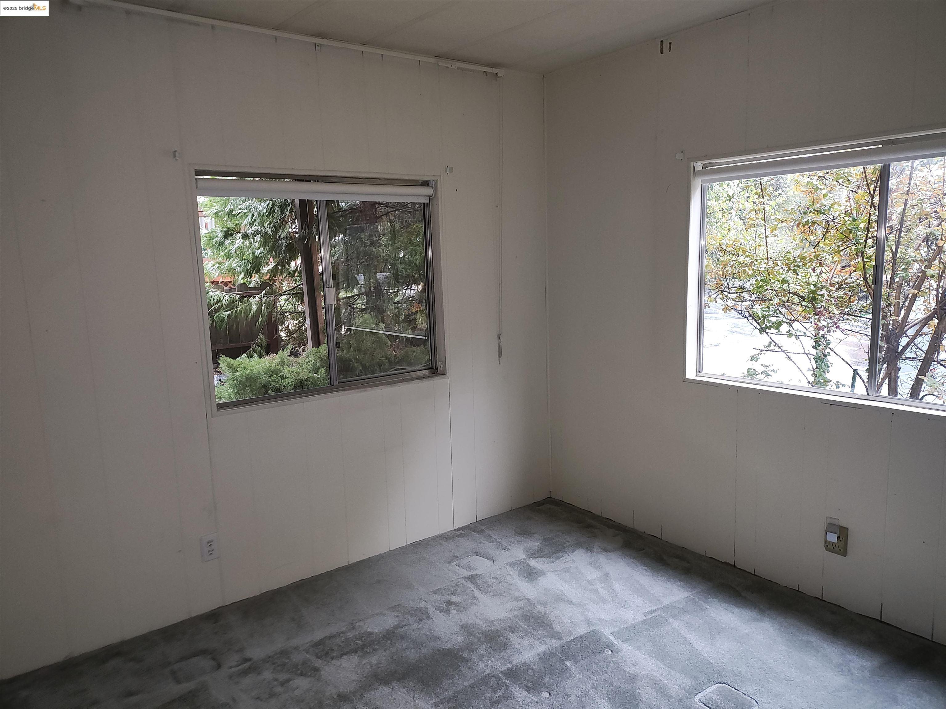 10956 Green Street, Unit 152 Columbia, CA 95310 - Photo 16 of 46 an empty room with a window