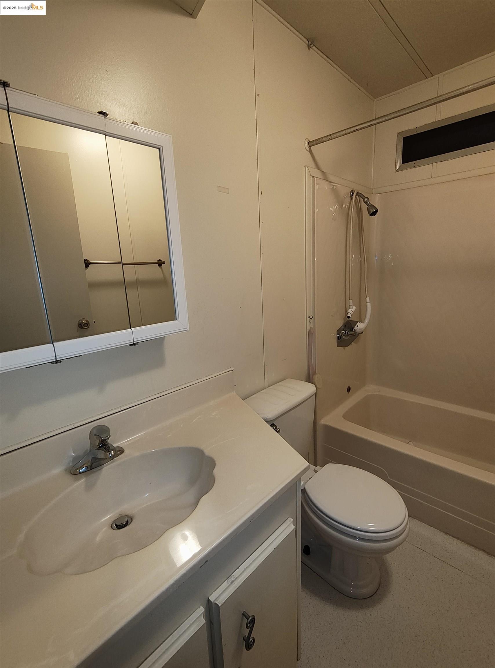 10956 Green Street, Unit 152 Columbia, CA 95310 - Photo 23 of 46 a bathroom with a sink toilet and shower