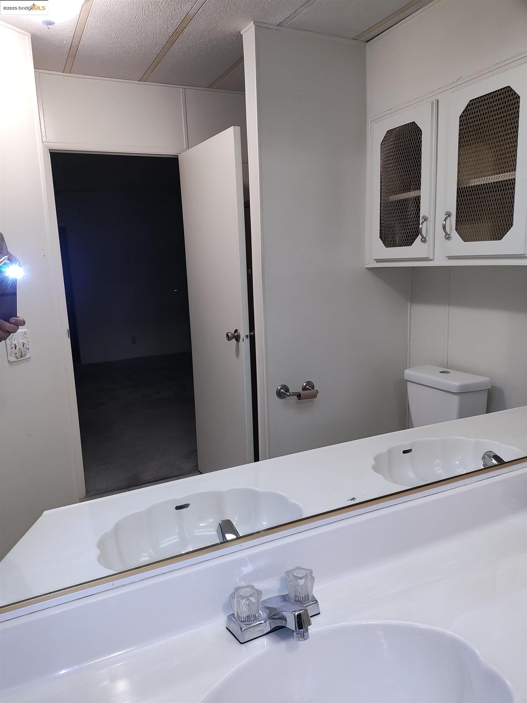 10956 Green Street, Unit 152 Columbia, CA 95310 - Photo 43 of 46 a bathroom with a sink and a mirror