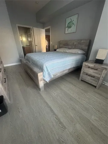 a bedroom with a bed and night stand