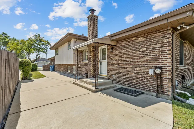 a front view of a house with yard