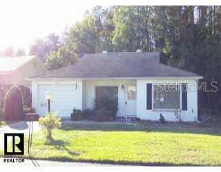 11807 Tupelo Drive New Port Richey, FL 34654 - Photo 1 of 1 a view of a house with swimming pool and a yard