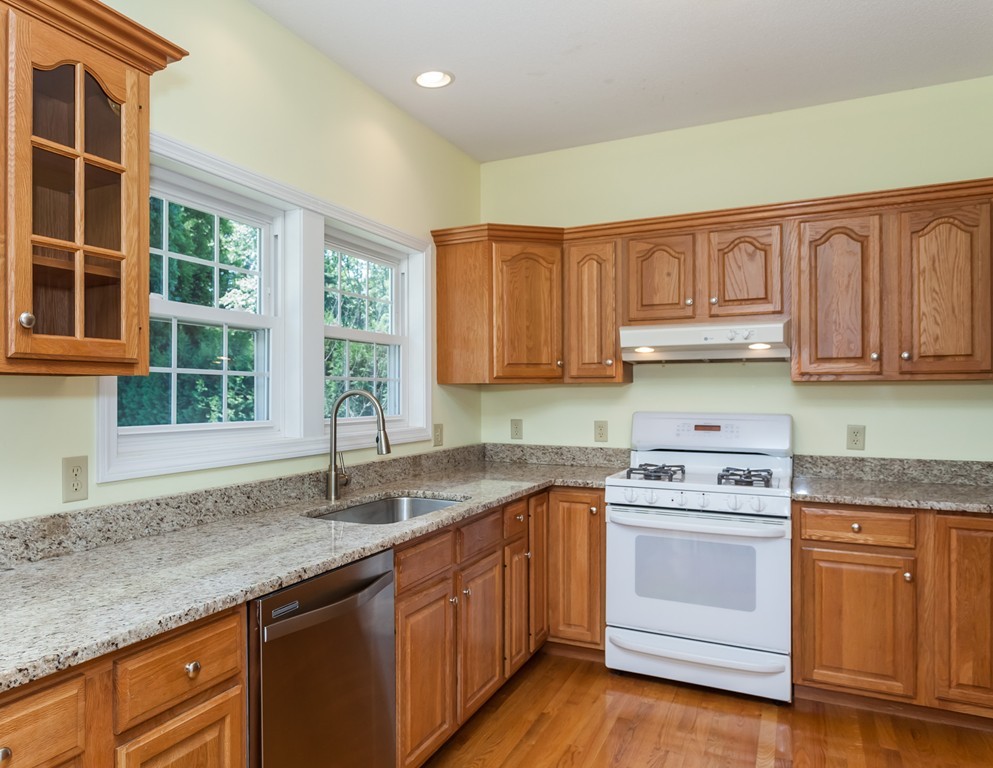 30 Two Ponds Road Belchertown, MA 01007 - Photo 4 of 26 a kitchen with granite countertop a sink stainless steel appliances and cabinets