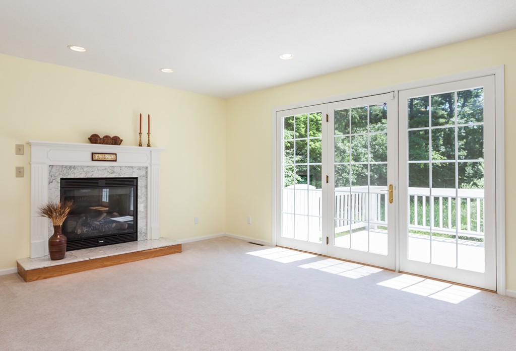 30 Two Ponds Road Belchertown, MA 01007 - Photo 7 of 26 a view of an empty room with a fireplace and a window