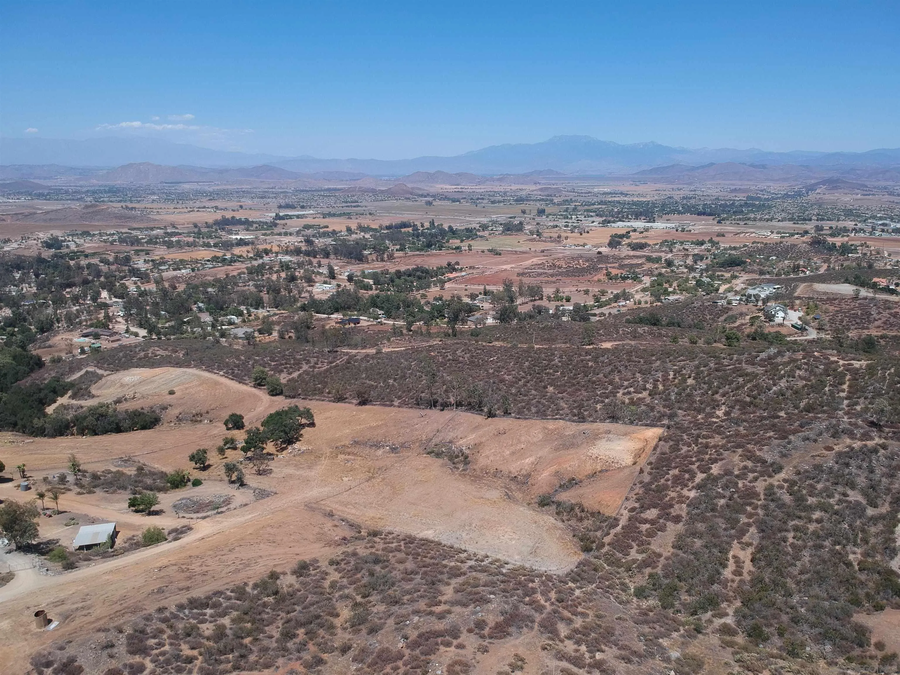 0 Elroy Road Menifee, CA 92584 - Photo 24 of 49 a view of a dry yard with wooden fence
