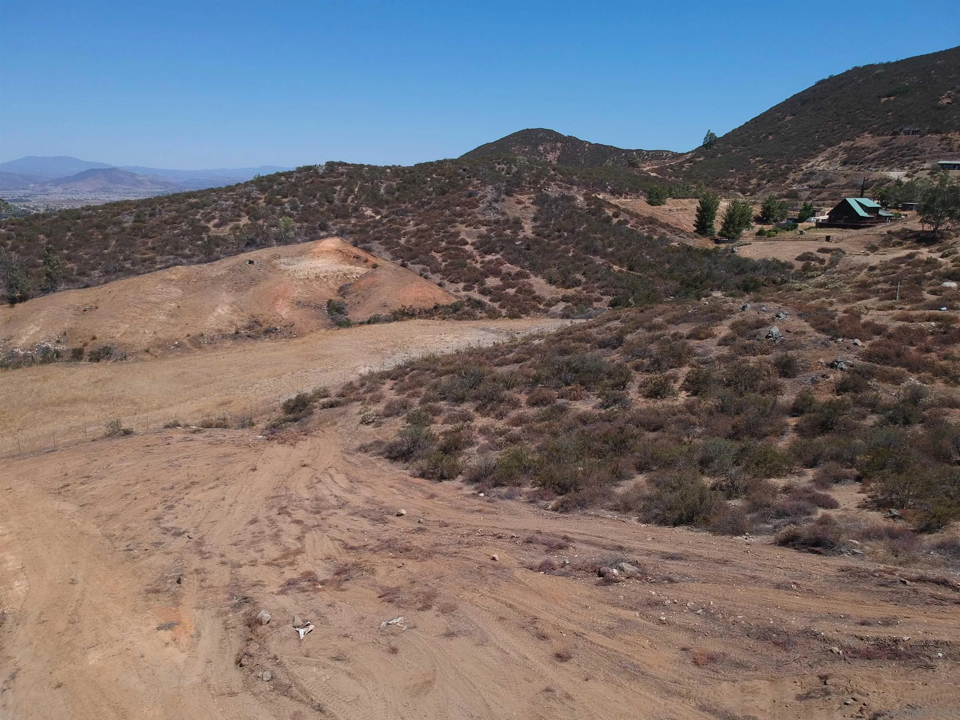 0 Elroy Road Menifee, CA 92584 - Photo 35 of 49 a view of a dry yard with mountains in the background