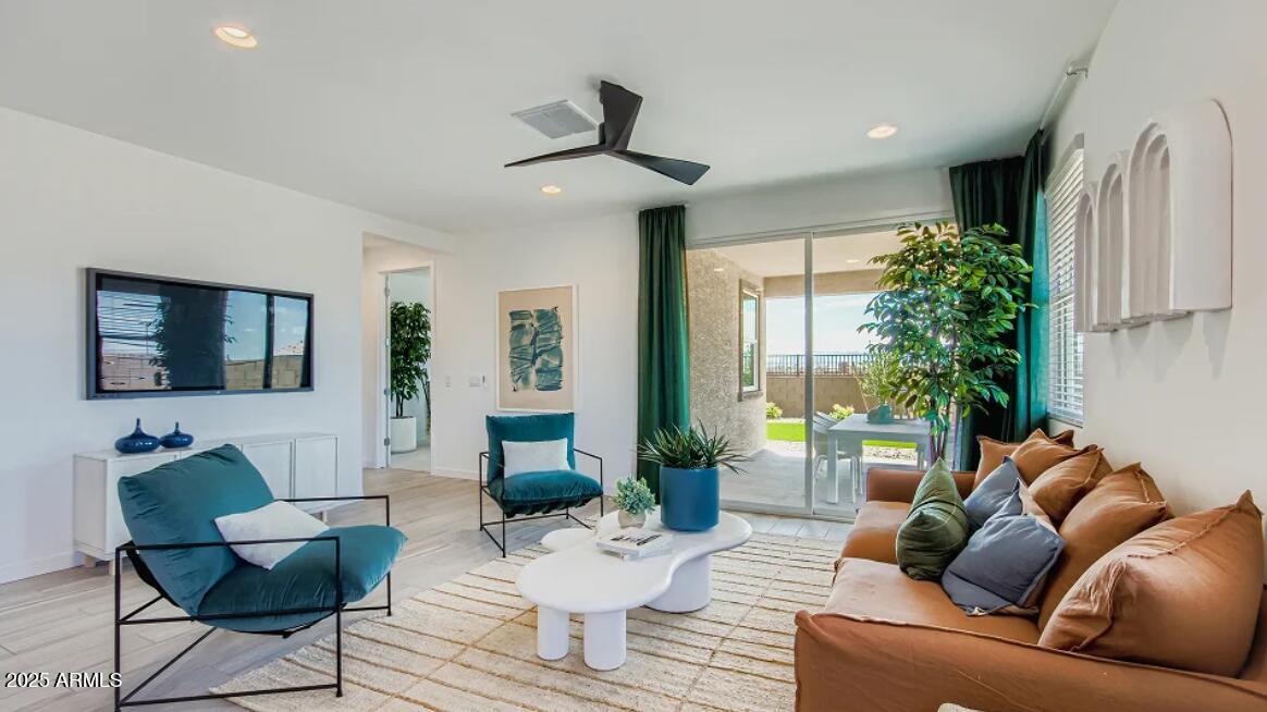 9540 West Flower Street Phoenix, AZ 85392 - Photo 6 of 22 a living room with furniture and a large window