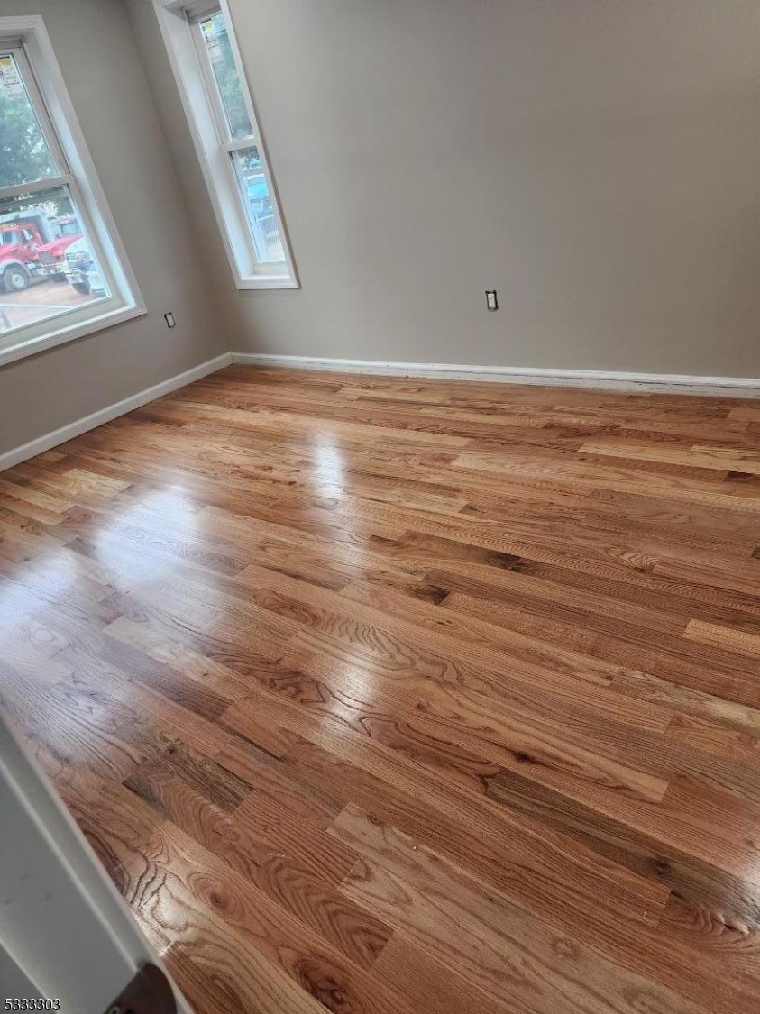 20 Garibaldi Avenue Newark, NJ 07114 - Photo 6 of 12 a view of empty room with wooden floor