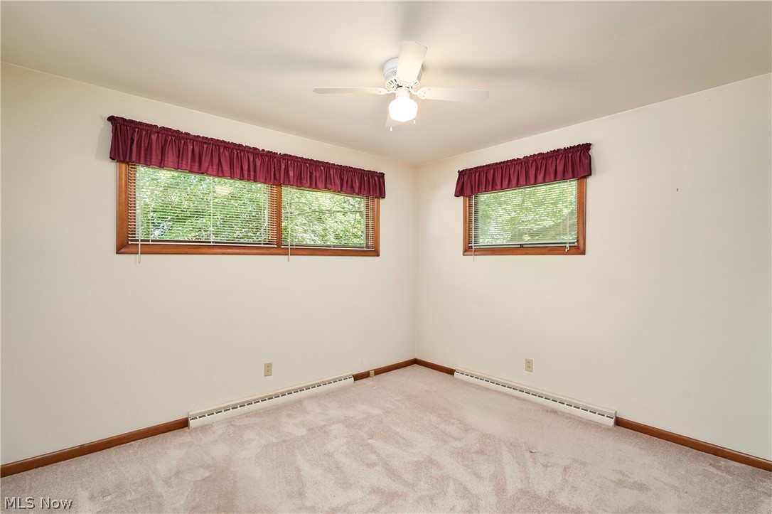 299 West Caston Road New Franklin, OH 44319 - Photo 16 of 23 Carpeted room with white walls and a ceiling fan