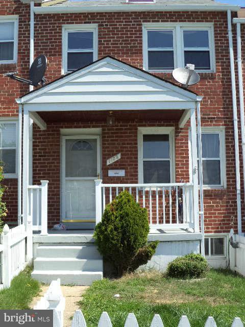 1132 Elm Road Baltimore, MD 21227 - Photo 1 of 27 a front view of a house with garden