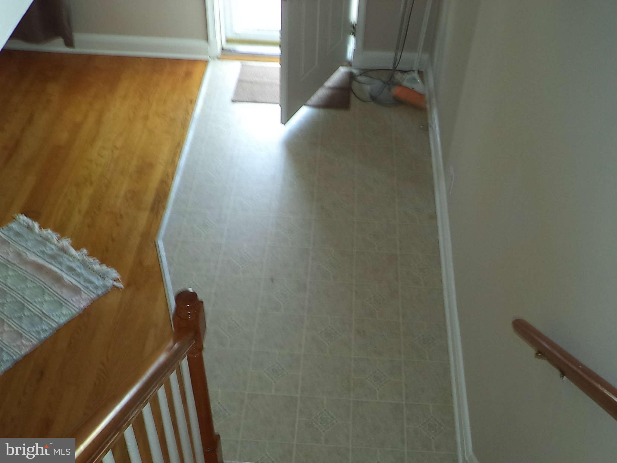 1132 Elm Road Baltimore, MD 21227 - Photo 4 of 27 a view of balcony with wooden floor