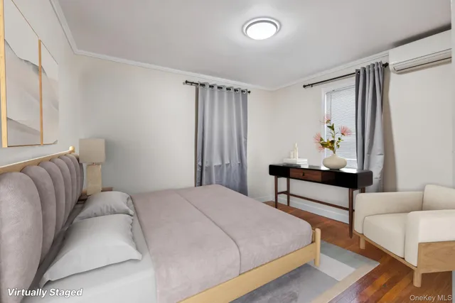 a bedroom with a bed and a night stand