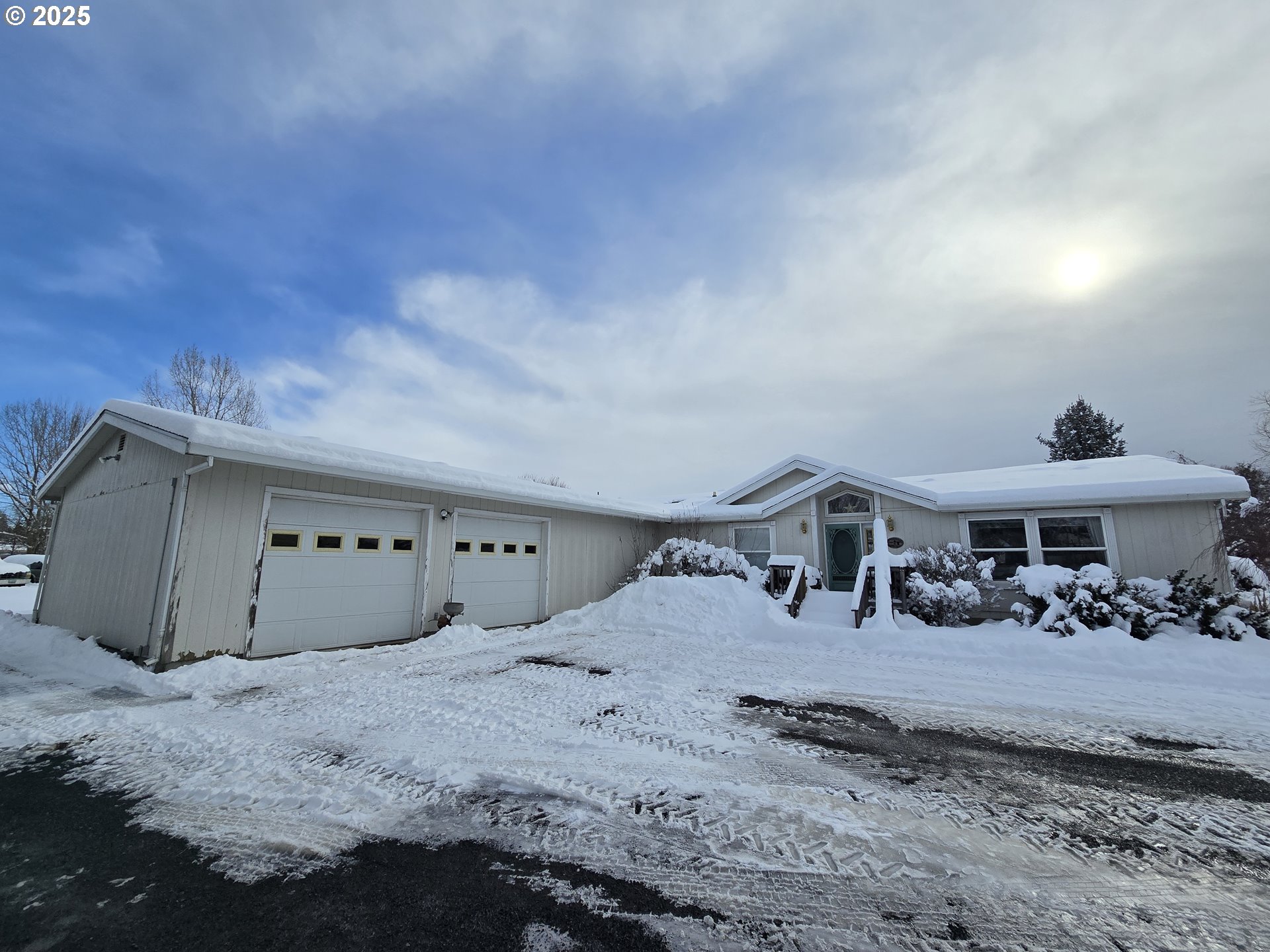 118 Fish Hatchery Lane Enterprise, OR 97828 - Photo 19 of 25 a bedroom with a bed and a large window