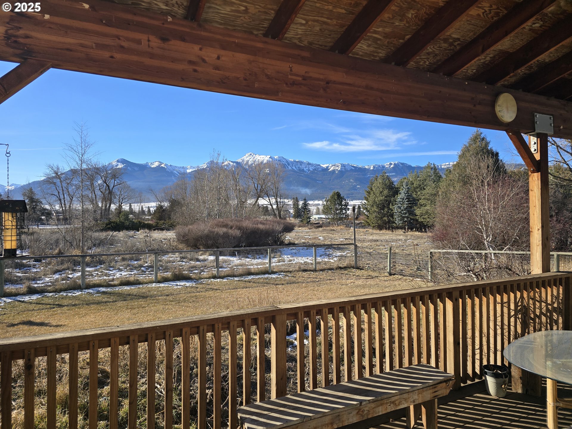 118 Fish Hatchery Lane Enterprise, OR 97828 - Photo 2 of 25 a view of balcony with wooden floor and a floor to ceiling window