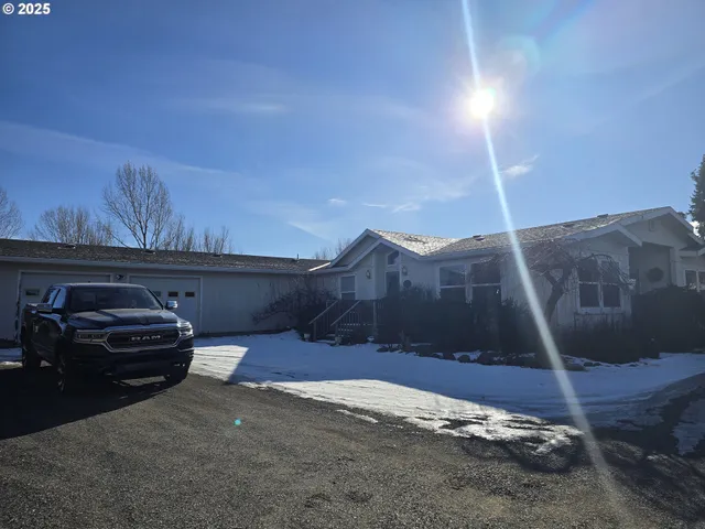 a view of a town with mountains in the background