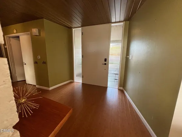 a bed room with a bed and a chair