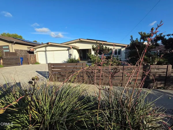 a view of a house with a street