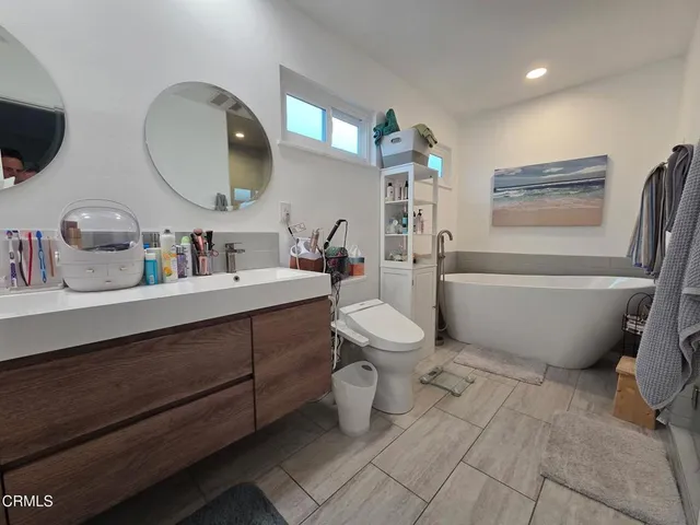 a bathroom with a bathtub sink and toilet