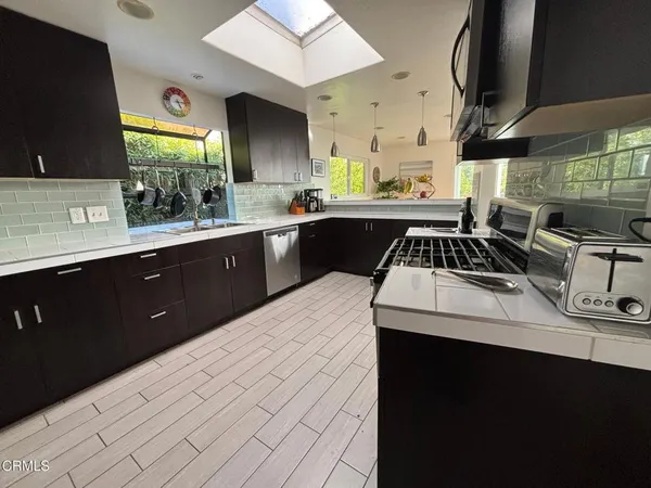a kitchen with a sink and cabinets