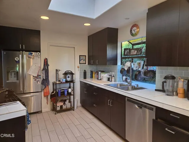 a dining room with furniture window and wooden floor