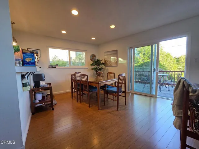 a view of a chairs on wooden deck