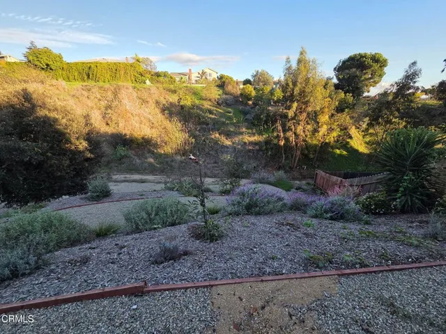 a backyard of a house with lots of green space