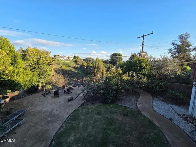 a backyard of a house with lots of green space