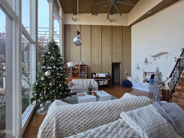 a living room with lots of furniture and a chandelier
