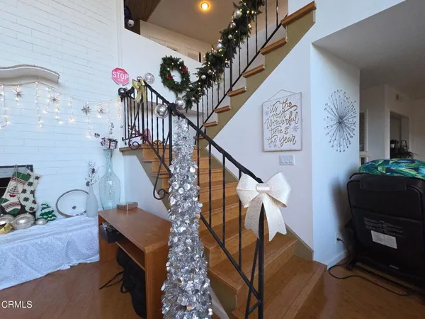 a front view of a house with patio outdoor seating and plants
