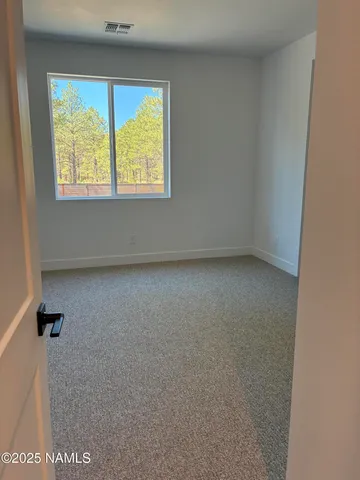 a bathroom with a sink a toilet and a large mirror